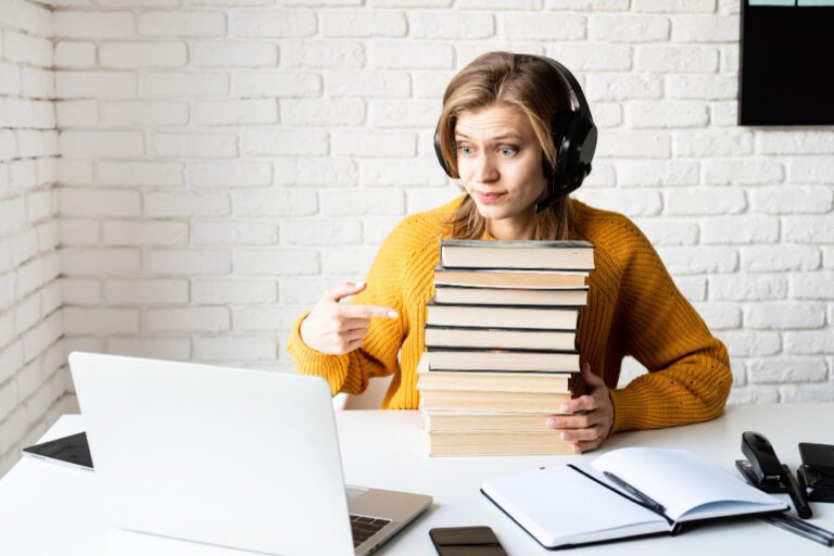 Distance Learning E Learning Young Woman Black Headphones Using Laptop Holding Stack Books
