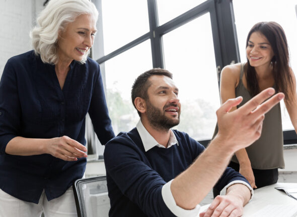 Group Of Business People Discussing Financial Plan At The Table In An Office
